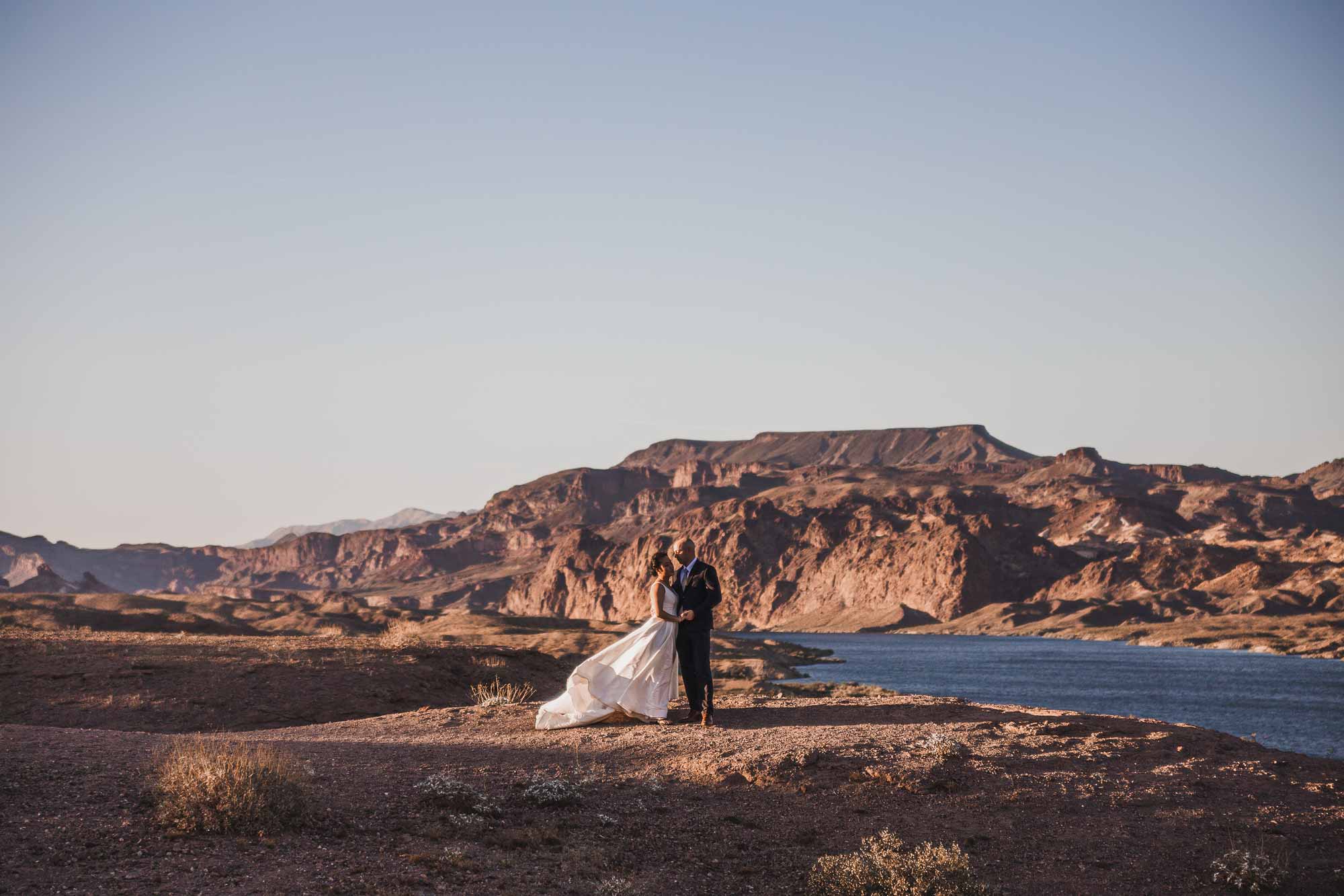 eloping couple saying their vows next to Colorado River for their elopement