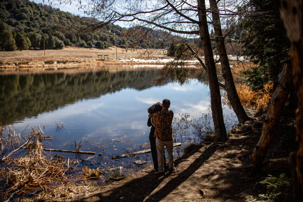 adventure elopement couple enjoying the views in the mountains after their ceremony