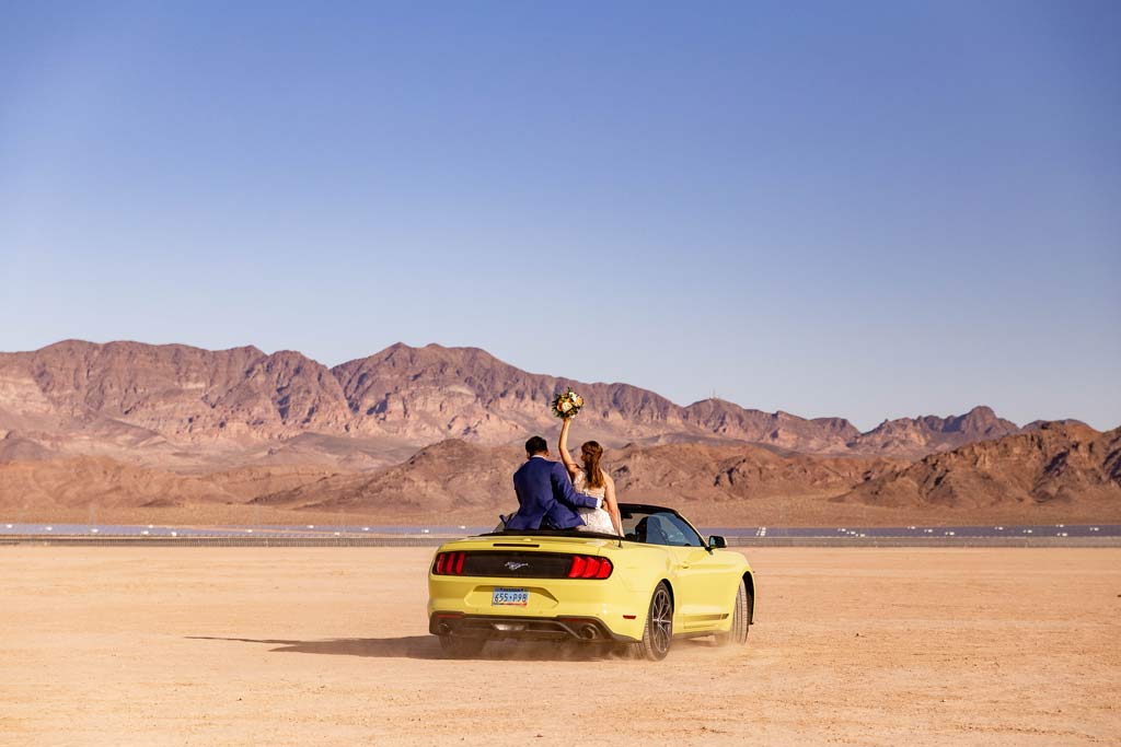 las vegas eloping couple in yellow mustang