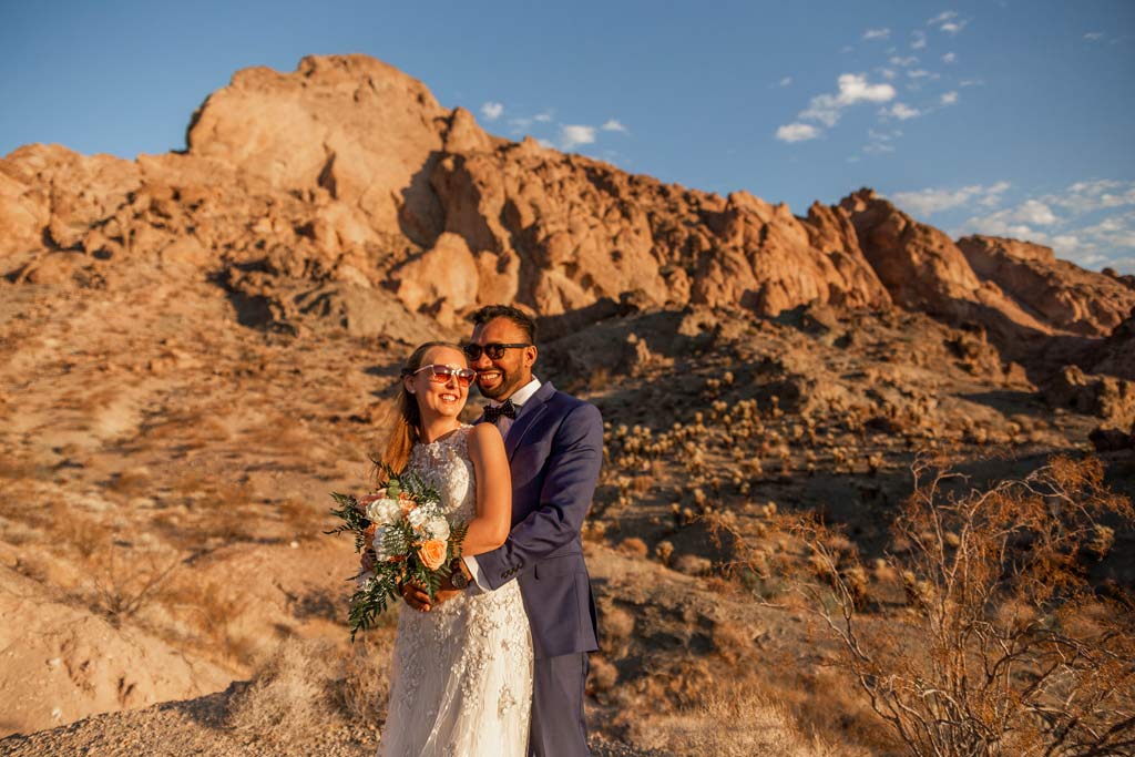 couple with sunglasses on in the canyon after their elopement