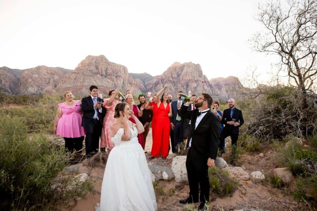 popping champagne during a las vegas elopement